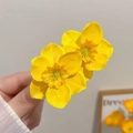 Pair of bright yellow daffodil gauze flower hair clips with delicate petal texture - Twin Flower Hair Clip