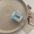 Detail of square hollow hair claw with blue pink marble pattern in ceramic dish - Small Square Claw / Sky Blue
