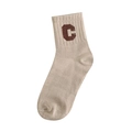 Close-up of beige cotton knit mid-calf sock featuring a brown letter C on the ribbed cuff - Light Coffee