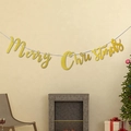 Golden glitter Merry Christmas banner hanging in a cozy holiday living room scene - Gold Pink / Gold