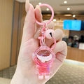 Pink astronaut keychain featuring internal white pearls, matching bell and round ring - Small Quicksand Astronaut - Pink