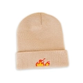 Close-up of flame embroidery detail on a warm beige knitted beanie for autumn - M (56-58cm) / Beige