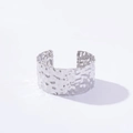 Detailed close-up of a silver-colored adjustable cuff bracelet with hammered texture finish - Wide Irregular Texture / Silver