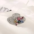 Elegant hat-shaped silver brooch with sparkling white rhinestones and colorful crystal flowers - Silver