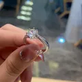 Detailed close-up of a six-prong classic silver ring featuring sparkling round diamonds - TJZ404-Six-Prong Micro Pave Band