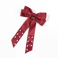Close-up of a red satin bow hair clip featuring elegant white pearl bead tassels - Burgundy