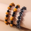 Halloween beaded bracelet set featuring orange pumpkin and black skull charms - 3-Piece Set / Colorful