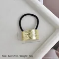 Close-up of golden alloy ponytail cuff with wavy texture and dimensions 4cm x 2cm - Gold Embossed Single Ring