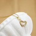 Titanium steel heart necklace with inlaid zircons in a elegant golden finish - No. 8 N0058 Gold