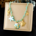 Blue woven rope necklace with starfish, turtle, and shell charms on a display box - Fish Starfish Turtle Shell Pendant Style (N3679)