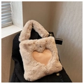 Detail of beige plush handbag featuring a PU heart patch on black coat background - Khaki