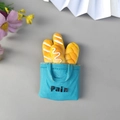 3D resin fridge magnet featuring a golden bread model in a blue decorative bread bag - New Blue Bread Bag