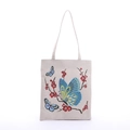 Detailed close-up of canvas tote bag featuring vibrant butterfly and plum blossom print - Butterfly