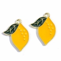 Detailed view of yellow enamel lemon charms with green leaves and gold metal edges - Lemon