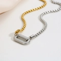 Macro detail of mixed gold and silver box chains with textured U-shaped buckle link - Beaded Chain Spiral Clasp / Two-tone Silver