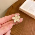 Floral claw clip with white pearls and gold alloy finish for small hair sections - Pearl Flower