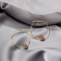 Golden hoop earrings with colorful crystal spheres displayed on soft silk fabric - Gold Hoop Colored Crystal Ball Earrings (E4572)