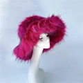 Vibrant rose red faux fur winter bucket hat with black tips on a white mannequin head - Fuschia