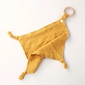Detail of yellow cotton muslin baby comforter with natural wooden teething ring and snaps - Ginger Yellow