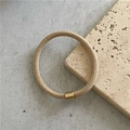 Detailed view of khaki twill high-elastic hair tie with decorative gold metal fastener - Khaki