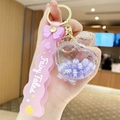 Pink Fairy Tales keychain featuring a clear heart-shaped bottle with purple letter beads - Letter Bead Perfume Bottle - Purple