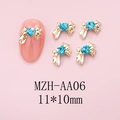 Charm per unghie fiocco dorato con strass a cuore blu, dettaglio misura 11x10mm - Base Oro Cuore Blu (AA06)
