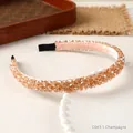 Elegant champagne beaded headband with four rows of crystals on a white display tray - Champagne