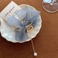 Golden metal hair claw clip with blue ribbon bow, chain and pearl pendant detail - Mesh Bow with Pearl Pendant / Blue Lace