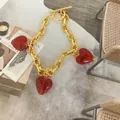 Gold OT buckle chain bracelet with three translucent red Murano glass heart charms - Bracelet / Red