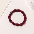 Macro view of burgundy braided hair tie with a decorative resin clasp on light background - Braided Twist - Plastic Buckle / Burgundy