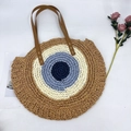 Handgefertigte runde Strohtasche mit Evil-Eye-Design und braunen Ledergriffen - Braun