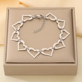 Pulsera de acero inoxidable plateado con eslabones de corazón hueco y cierre de langosta - Estilo Corazón Hueco Plateado (KB210099-Z)