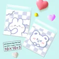 Close-up of 10x10+3cm transparent self-adhesive bags with purple checkered cartoon patterns - 2-in-1 Cartoon Style / 10x10+3cm (Approx. 100pcs)