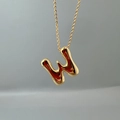 Detailed view of a gold initial W pendant with a sleek polished metallic finish on a fine chain - Letter W Single Pendant