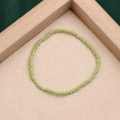 Handmade light green seed bead bracelet with polished finish on a beige textured base - Style 30-Light Green Clear Beads
