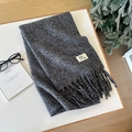 Thick dark grey cashmere feel scarf with tassel edges shown in a cozy winter setting - 38 Black Gray / Over 175cm