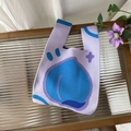 Detail of light purple knitted tote bag with blue peach pattern on textured glass - Peach Purple