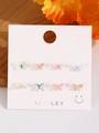 Set of eight colorful resin butterfly stud earrings on a white jewelry display card - 91 Bright Silver 11929