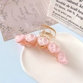 Pink heart-shaped hair claw clip with glossy finish displayed on a white tray - 5 Hearts Claw Clip