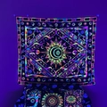 Glow-in-the-dark bohemian tapestry with celestial sun and moon patterns in neon light - Geometric Starry Fluorescent
