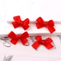 Set of four vibrant red satin ribbon bow hair clips with smooth silk texture - Red