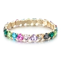 Macro view of colorful heart-cut zircons and gold-plated setting on a stretch bracelet - Colorful