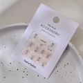 Close-up of 3D silver frame sky blue rhinestone nail jewelry set on a display tray - MJ-065 Silver Stamping