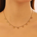 Close-up of golden necklace with eight hollow heart pendants on woman neck - Gold Hollow Heart