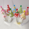 Kids birthday party set with cartoon cone hats pom poms and festive paper crowns - Cherry Smile Face Crown Party Hat Set