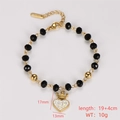 Detail of gold heart crown charm bracelet with black faceted beads and size specs - Heart Crown Pendant Style