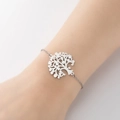 Silver stainless steel chain bracelet with hollow tree of life charm worn on wrist - Large Tree Steel Color