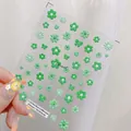 Macro detail of TS-1183 embossed 3D nail stickers with green floral and heart patterns - TS-1183 Green Willow Relief
