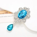 Floral silver brooch with large oval blue crystal and teardrop pendant accessory - Silver Base Blue Pendant