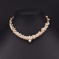 Baroque petal necklace featuring white freshwater pearls with a gold wire weave design - Multi-Pearl Woven